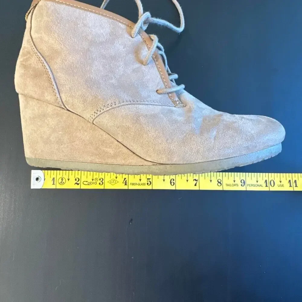 Tan suede ankle boots with lace-up design and chunky sole